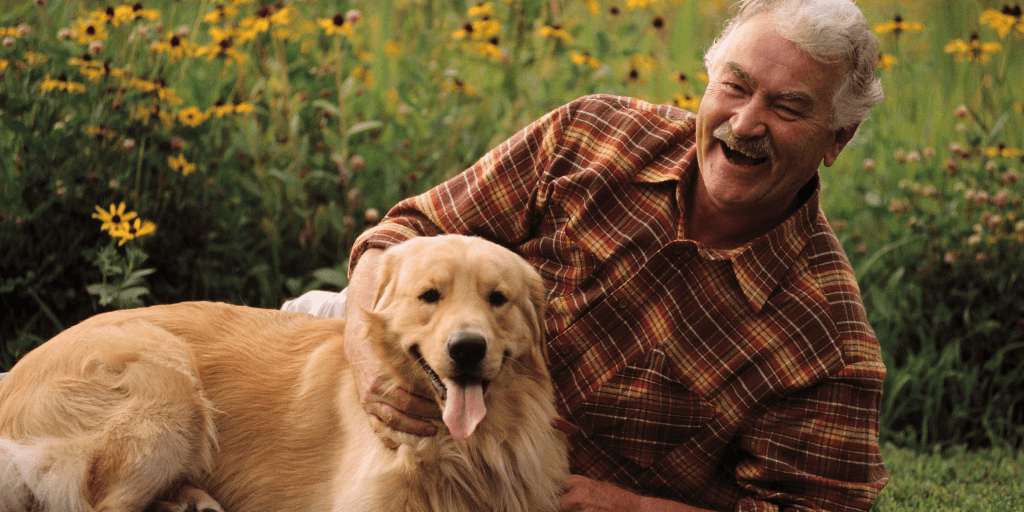 Man sitting with dog.