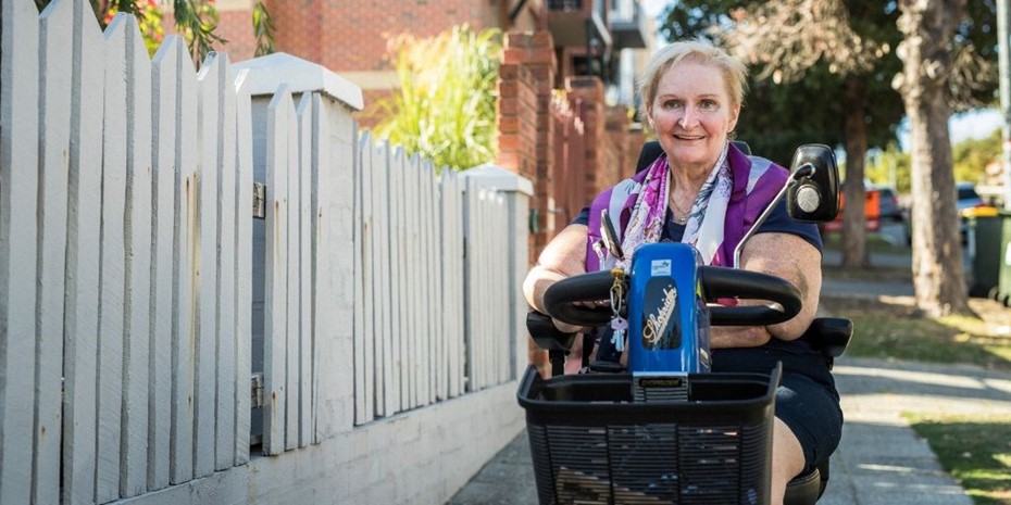 Woman on mobility scooter smiling