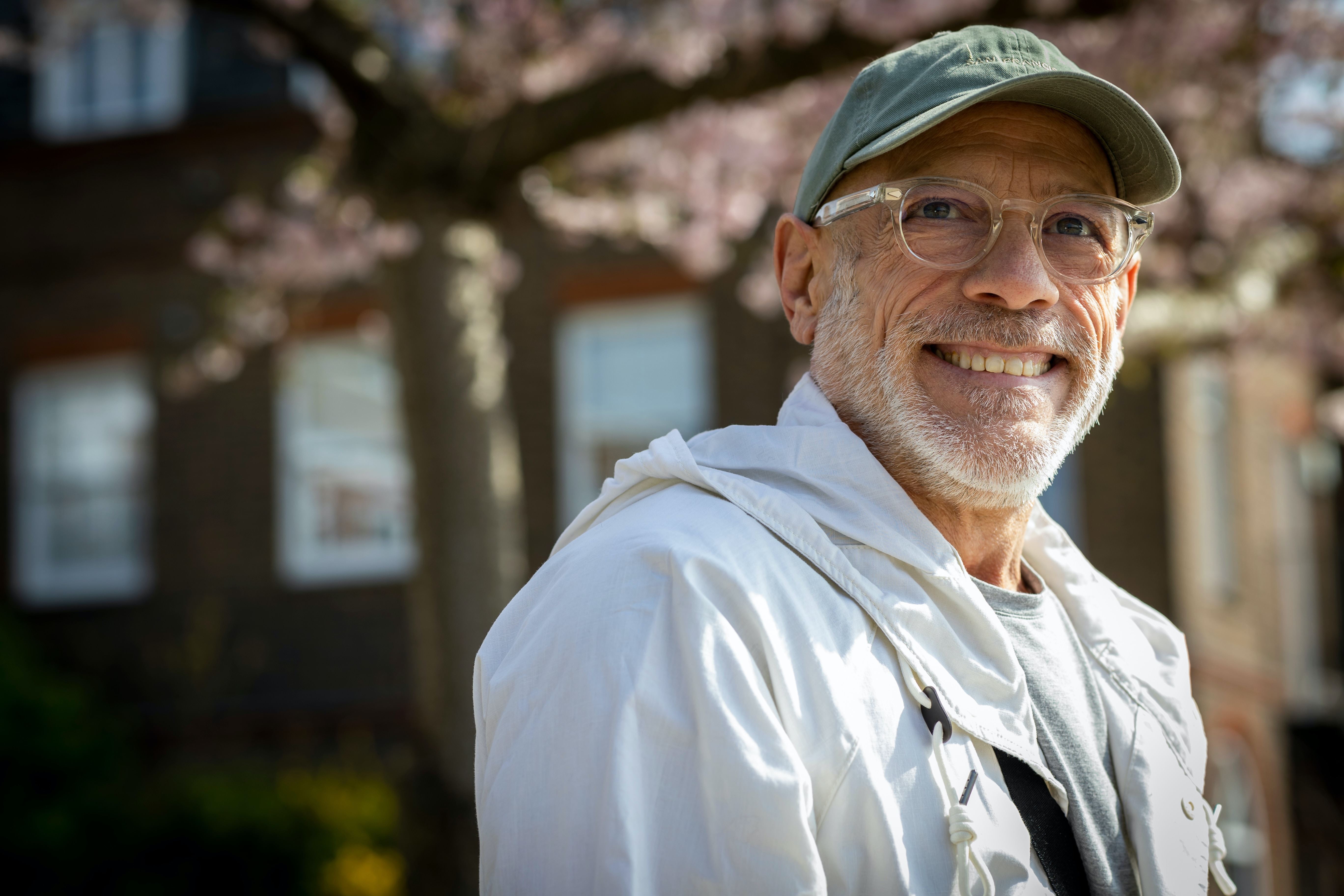 An image of an older man in a green cap who is thinking about advance health directive, enduring power of attorney and enduring power of guardianship.