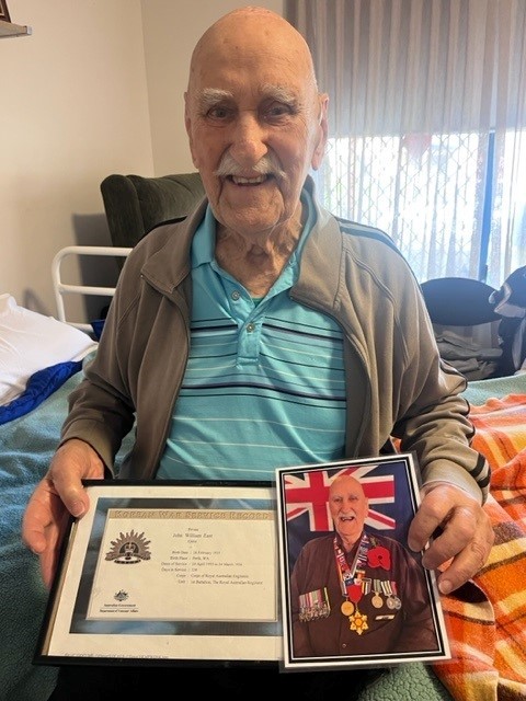 Brightwater resident John East displays his war certificate and medals